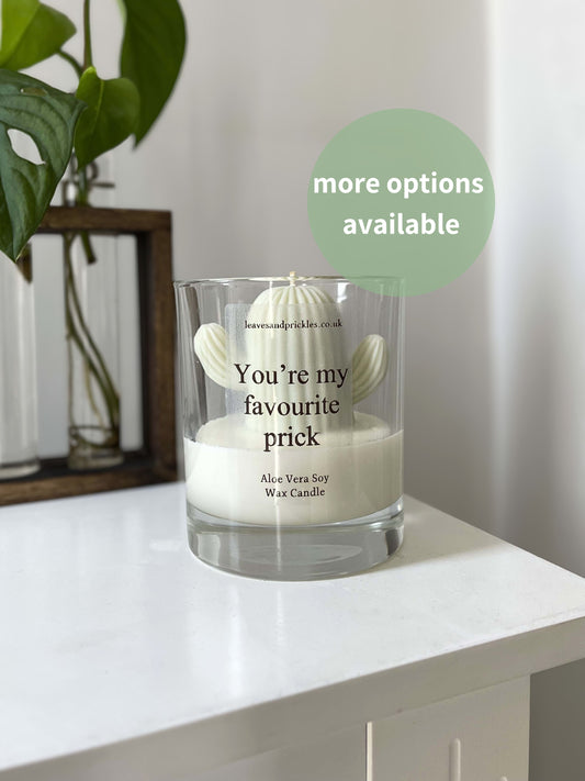 Funny green cactus candle in glass jar