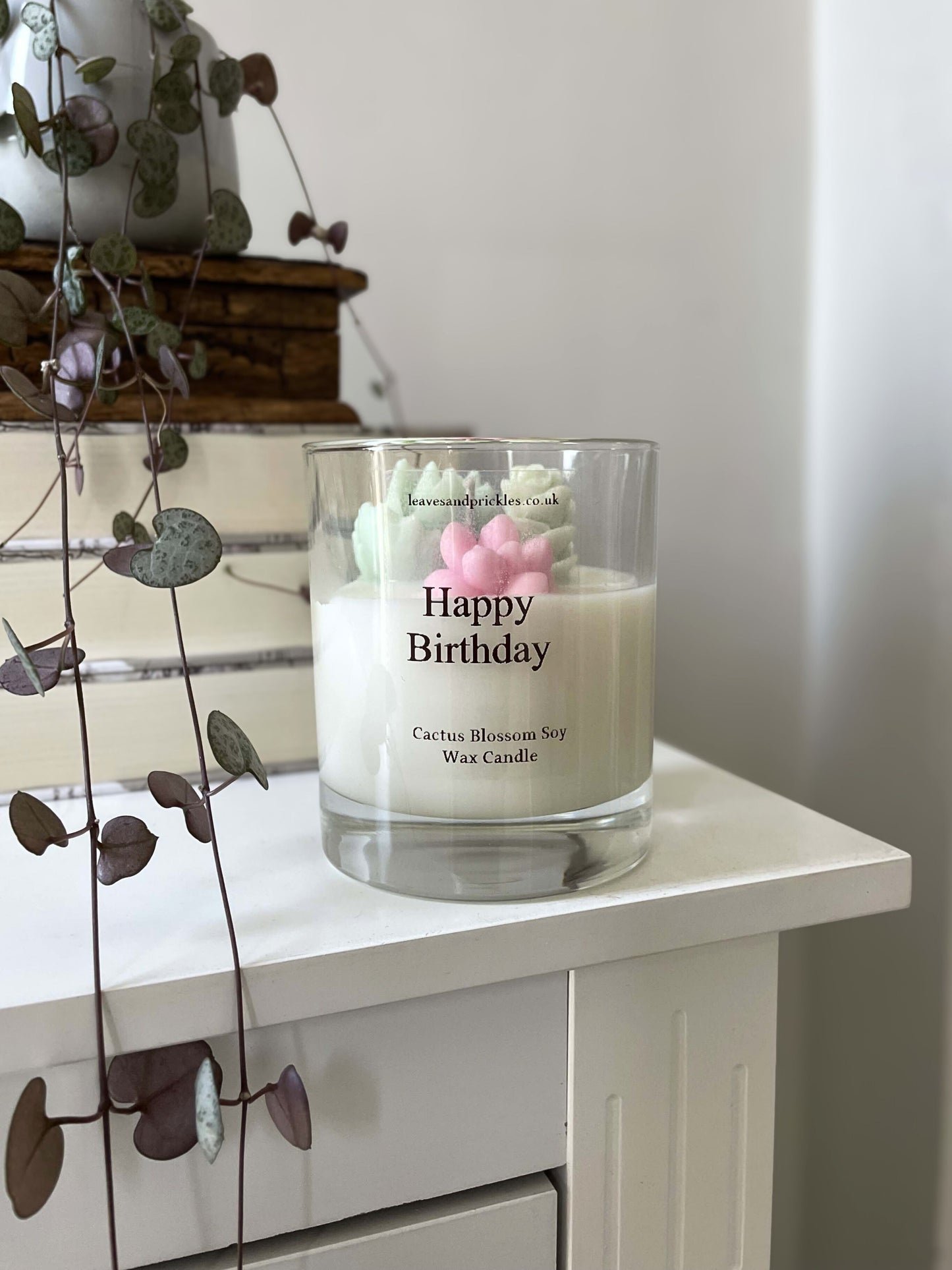 pink and green birthday terrarium candle in glass jar