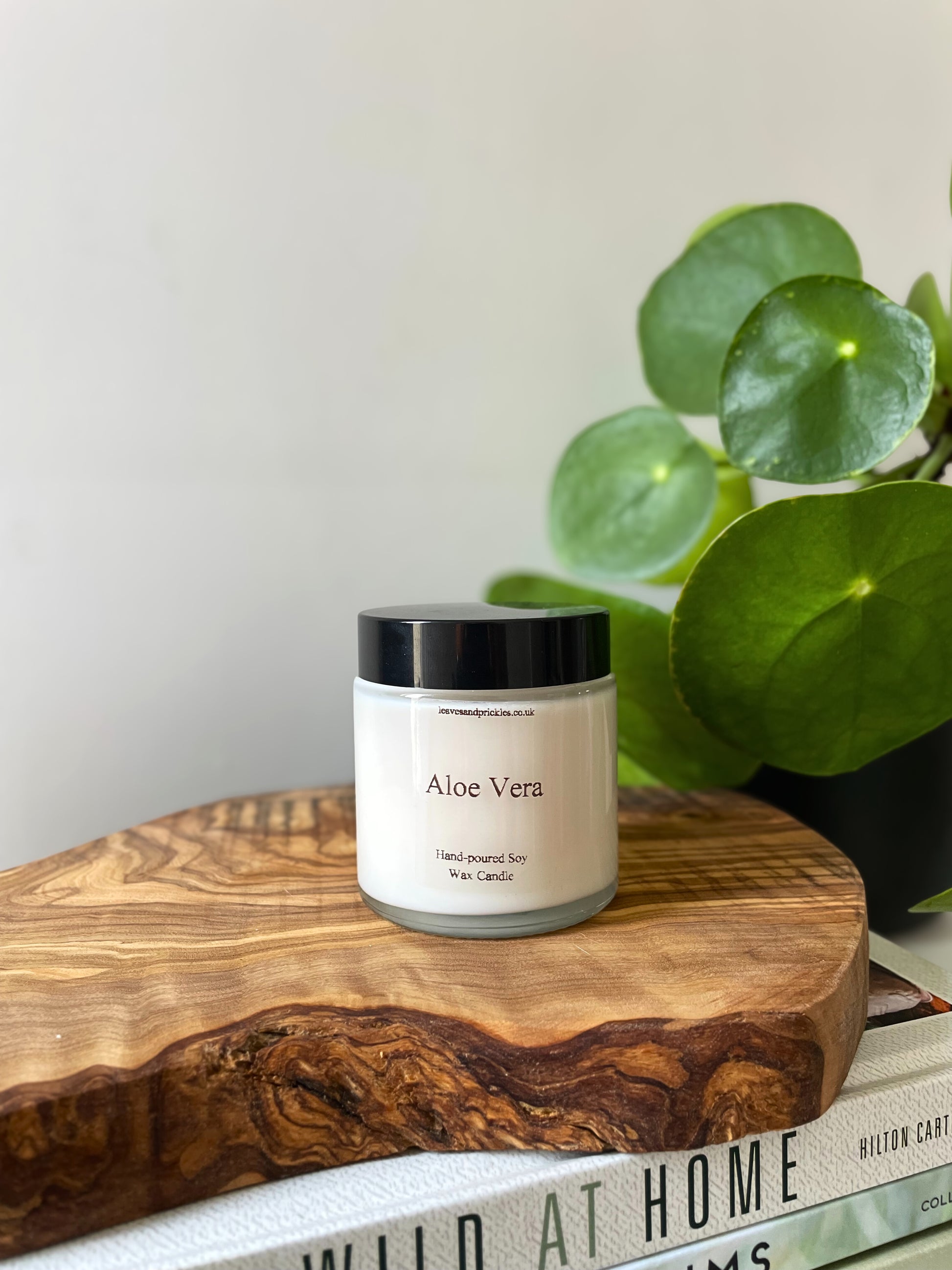 Aloe vera scented candle in a glass jar with a lid 